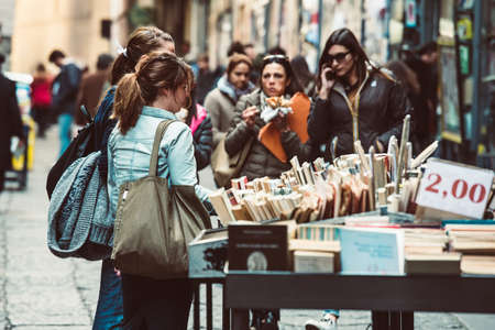 NAPLES, ITALY - MARCH 20, 2015: People looking around in the second hand book stalls of the book market in the historical center of Naples, Italyのeditorial素材