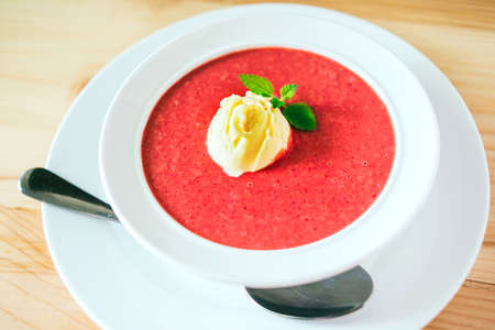 Cold summer dessert -strawberry soup with vanilla ice creamの写真素材