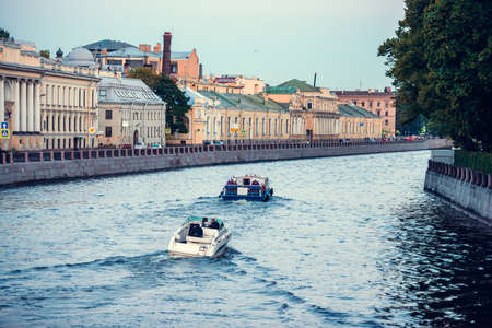 Small boats on Fontanka river during white nights in Saint Petersburg, Russiaの写真素材