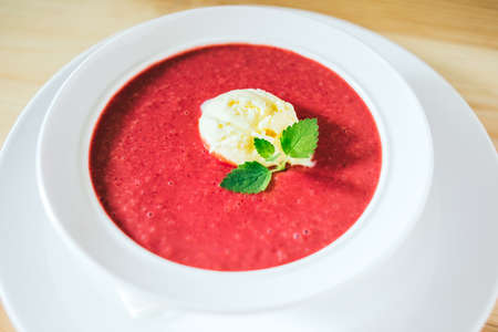 Cold summer dessert -strawberry soup with vanilla ice creamの写真素材