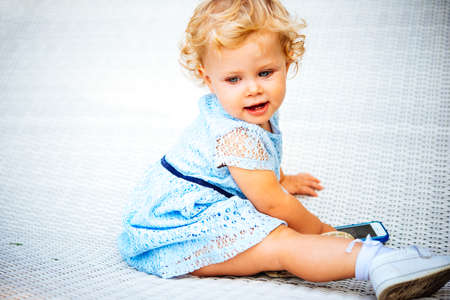 Portrait of cute blonde baby girlの写真素材