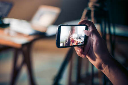 Person is taking photo with a smartphone.