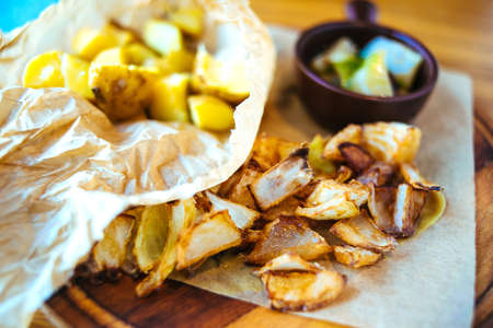 Roasted onions and potatoes with marinated mushrooms in rustic styleの写真素材