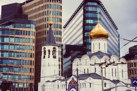 The view of the church of St Nicholas and The White Square business centre in Moscow, Russia. Toned...