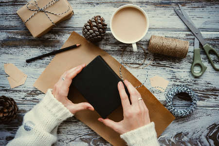 Christmas or New year gift packing. Holiday decor concept. Toned pictureの写真素材