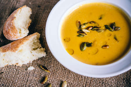 Roasted pumpkin and carrot soup and pumpkin seedsの写真素材