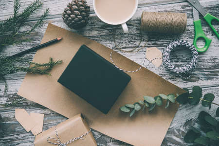 Christmas or New year gift packing. Holiday decor concept. Toned pictureの写真素材