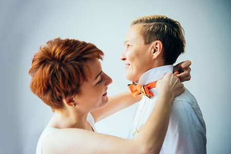 Beautiful lesbian couple is getting ready for their wedding. Gay marriage conceptの写真素材