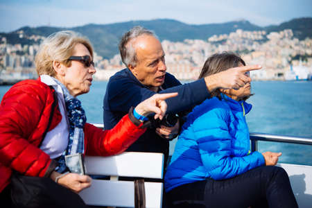 GENOA, ITALY - OCTOBER 27, 2015: Tourists enjoy the weather and take pictures in Porto Antico in Genoa, Italy.のeditorial素材