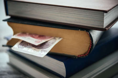 Pile of books and turkish lira billsの写真素材