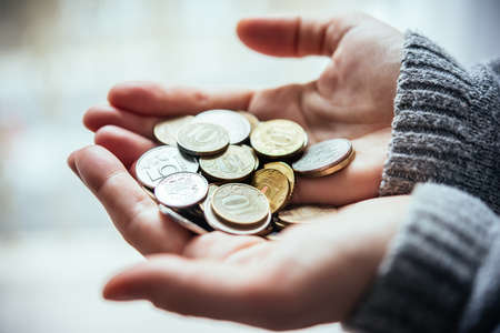 Hands holding russian rouble coins in handsの写真素材