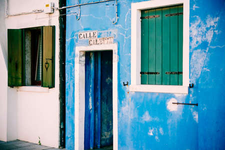 The colourful door of one of the houses at Burano island, Venice, Italyの写真素材