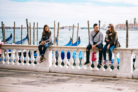VENICE, ITALY - OCTOBER 12, 2015: Tourists are enjoyng the view of Grand Canal near San Marco square in Venice, Italyのeditorial素材