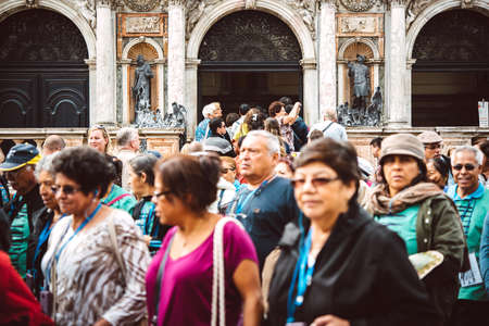 VENICE, ITALY - OCTOBER 12, 2015: A crowd of tourists is walking at San Marco square in Venice, Italyのeditorial素材