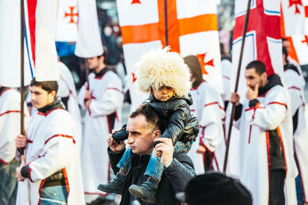 GEORGIA, TBILISI - JANUARY 7, 2016:  Participants march during Alilo, a religious procession to celebrate Orthodox Christmas in center of Tbilisi, Georgia, Caucasus region.のeditorial素材