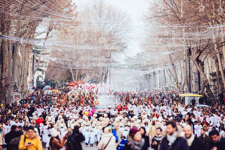GEORGIA, TBILISI - JANUARY 7, 2016:  Participants march during Alilo, a religious procession to celebrate Orthodox Christmas in center of Tbilisi, Georgia, Caucasus region. Toned in old film styleのeditorial素材