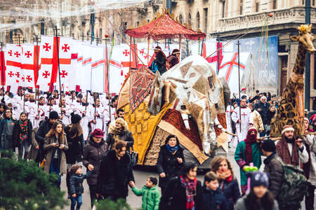 GEORGIA, TBILISI - JANUARY 7, 2016:  Participants march during Alilo, a religious procession to celebrate Orthodox Christmas in center of Tbilisi, Georgia, Caucasus region. Toned in old film styleのeditorial素材