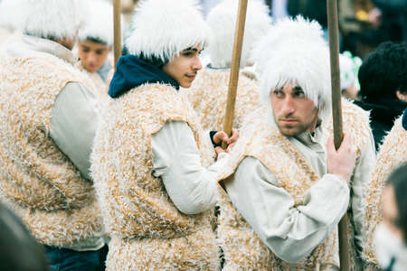 GEORGIA, TBILISI - JANUARY 7, 2016:  Men dressed as shepherds participate in Alilo, a religious procession to celebrate Orthodox Christmas in the centre of Tbilisi, Georgia. Toned in old film styleのeditorial素材
