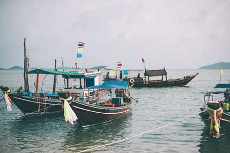 Colorful fishing boats in Thailand. Toned pictureの写真素材