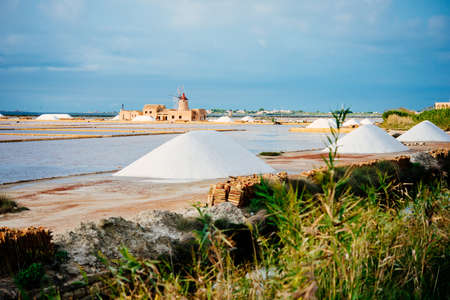 Salt mills are seen in saburbs of Marsala, Sicily, Italy. Selective focus on millsの写真素材