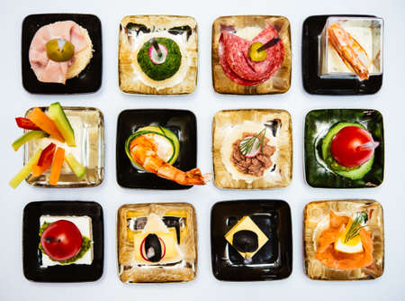 Different snacks and appetizers ready for a cocktail party. Catering concept.の写真素材