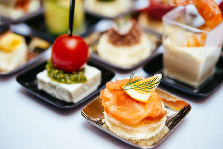 Different snacks and appetizers ready for a cocktail party. Catering concept.の写真素材