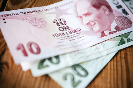 Turkish lira bills on wooden tableの写真素材