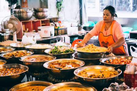KOH SAMUI, THAILAND - MARCH 14, 2016: Different kinds of thai food on sale at one of the street markets at Koh Samui, Thailand. Selective focusのeditorial素材