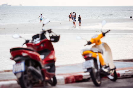 KOH SAMUI, THAILAND - FEBRUARY 18, 2016: People walk in low tide at the seashore of Koh Samui, Thailand.のeditorial素材