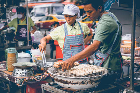 KOH SAMUI, THAILAND - FEBRUARY 18, 2016: Street food market in one of the villages of Koh Samui, Thailand. Toned pictureのeditorial素材