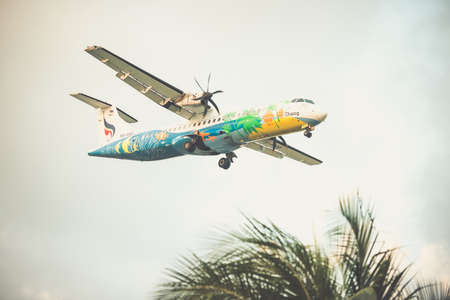 KOH SAMUI, THAILAND - FEBRUARY 22, 2016: Passenger plane landing at the airport of Koh Samui, Thailand. Toned pictureのeditorial素材