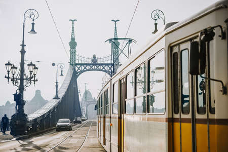 A tram entering Liberty bridge in Budapest, Hungary. Toned pictureのeditorial素材