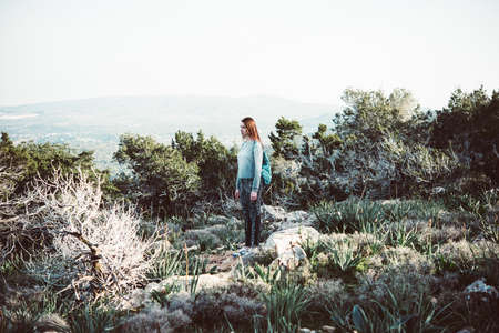 Young beautiful woman hiking in the wild nature.のeditorial素材