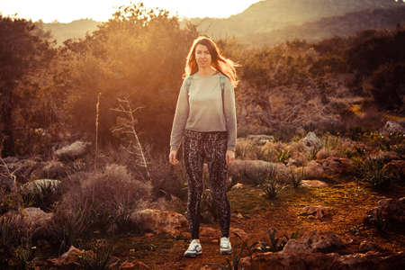 Young beautiful woman hiking in the wild nature.のeditorial素材