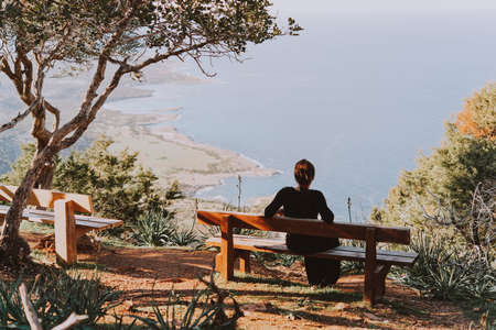 Woman enjoying a picturesque view of Akamas peninsula in Cyprus. Toned imageの写真素材