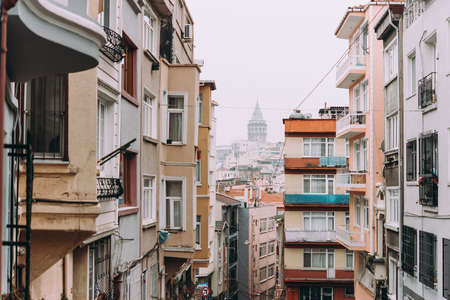 The view of the Galata Tower seen from one of the streets in Beyoglu, Istanbul, Turkey.の写真素材