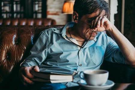 Mature handsome man feeling sad, tired or depressed.の写真素材