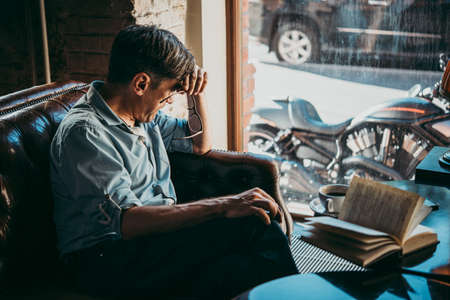 Mature handsome man feeling sad, tired or depressed.の写真素材