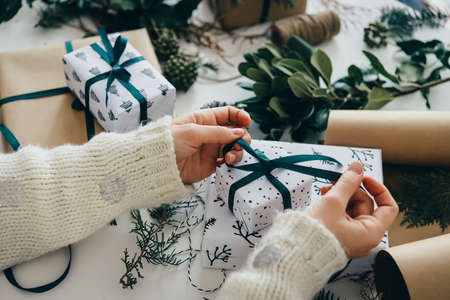 Christmas or New year gift packing. Holiday decor concept.の写真素材