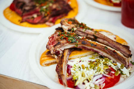 Grilled lamb ribs on a plate.