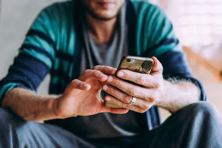 Mature handsome man  using his smartphoneの写真素材