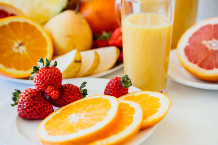 Fresh fruits and orange juice. Healthy diet conceptの写真素材