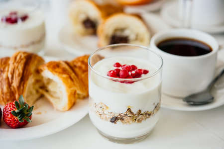 Granola with yogurt and berries served for breakfastの写真素材