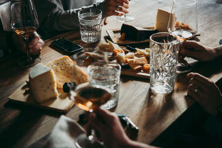 Wine and cheese served for a friendly party in a bar or a restaurant.