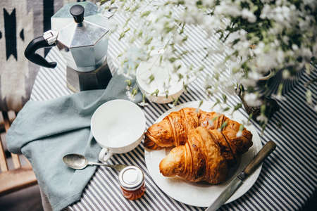 Breakfast with croissants, jam and coffeeの写真素材