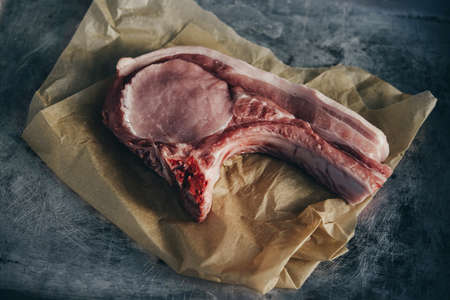 A pork chop on a craft paperの写真素材