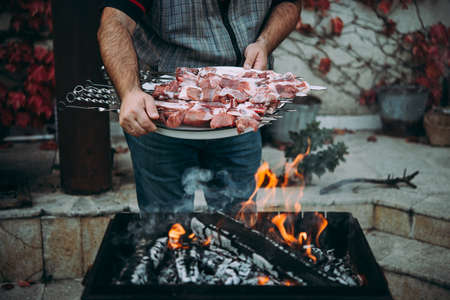 Preparing classic style barbecue in a countryside.