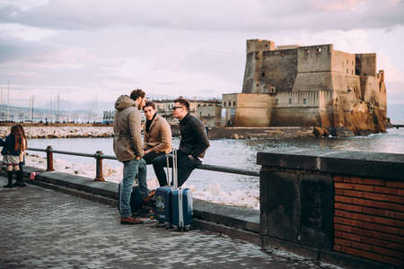 NAPLES, ITALY - 18 DECEMBER, 2017: People enjoy relaxing at the seaside in Naples, Campania, Italy.のeditorial素材