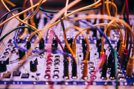 A close-up of a modular synthesizer. Electronic music and professional music equipment concept.の写真素材