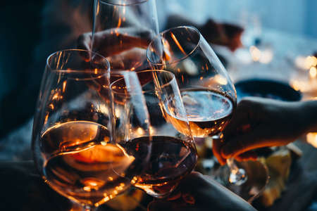 Glasses of wine seen during a friendly party of a celebration.の写真素材